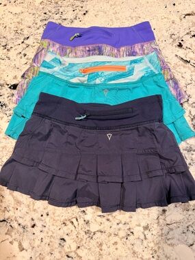Girls Aviva (lululemon) size 7 skirts set of 3. Purple pattern, turquoise & navy